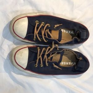 Navy blue and red slip on converse